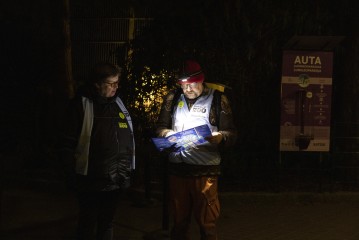 Staff reading the map at the Night of the Cats