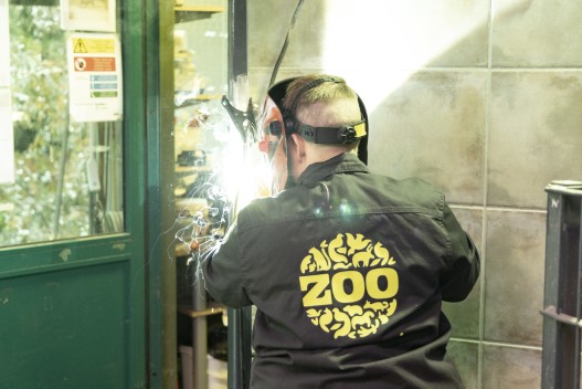 Zoo's maintenance worker welding